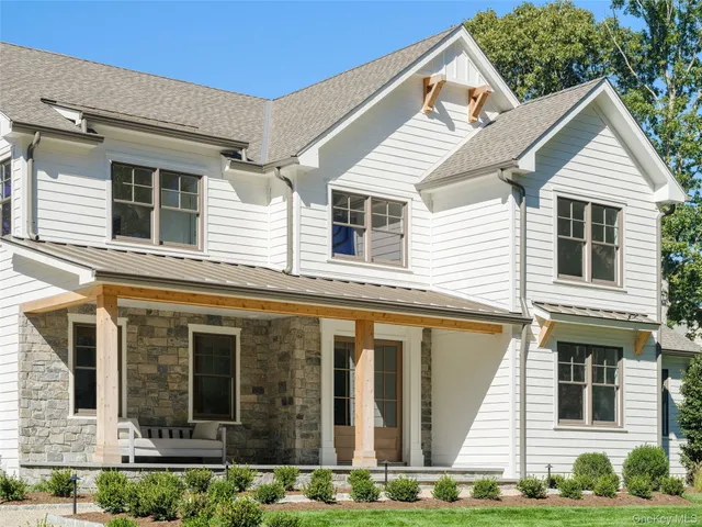 a view of a dining room with furniture and windows
