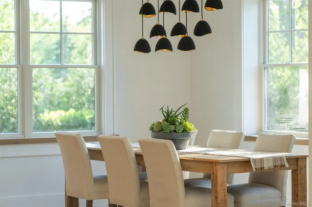 a bathroom with a toilet a sink and a mirror