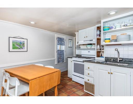 42 Elm Street Marblehead, MA 01945 - Photo 12 of 28 a kitchen with stainless steel appliances granite countertop a sink and cabinets