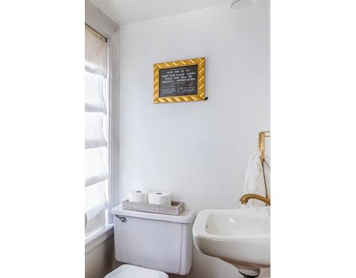 42 Elm Street Marblehead, MA 01945 - Photo 13 of 28 a bathroom with a toilet sink and mirror