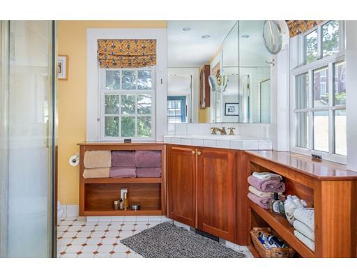 42 Elm Street Marblehead, MA 01945 - Photo 16 of 28 a bathroom with a sink a bathtub and a large mirror