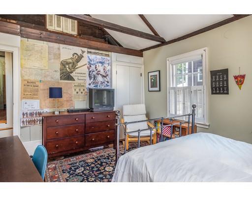 42 Elm Street Marblehead, MA 01945 - Photo 22 of 28 a bedroom with a bed and wooden furniture