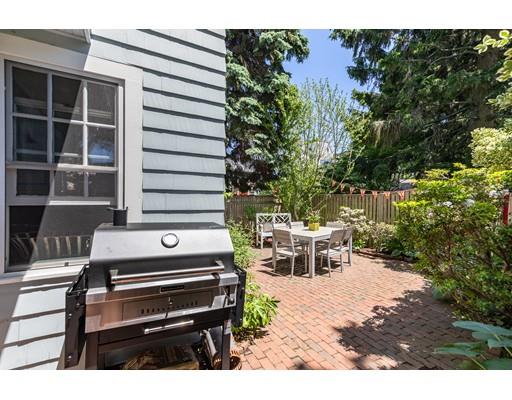 42 Elm Street Marblehead, MA 01945 - Photo 26 of 28 a view of a patio with table and chairs with wooden floor and plants