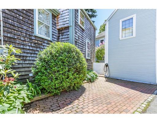 42 Elm Street Marblehead, MA 01945 - Photo 3 of 28 a backyard of a house with lots of green space
