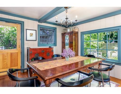 42 Elm Street Marblehead, MA 01945 - Photo 10 of 28 a living room with furniture a chandelier and a table