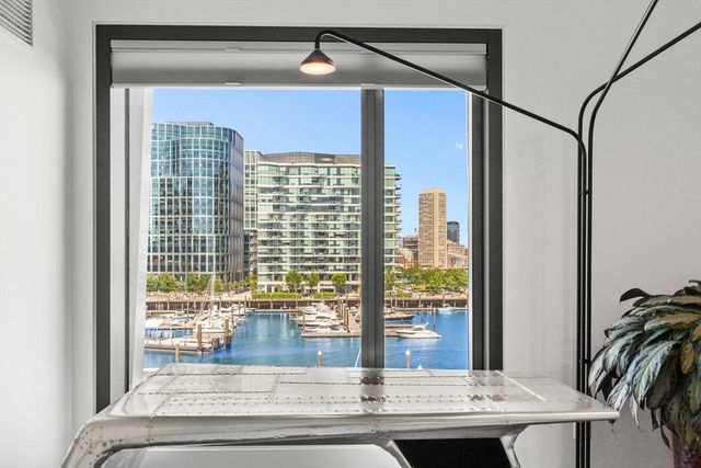 a view of living room with a floor to ceiling window and floor
