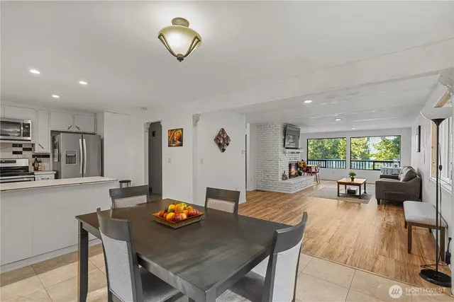 a kitchen with stainless steel appliances a sink stove and refrigerator