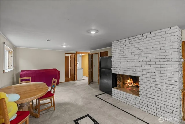 a view of a room with wooden floor and window