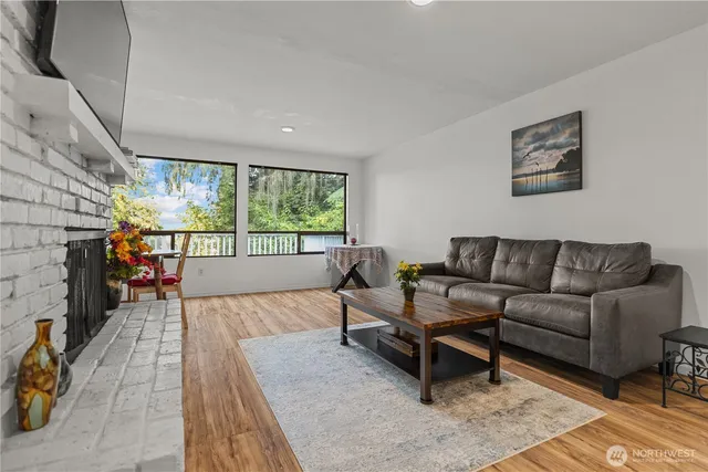 a kitchen with a refrigerator a stove top oven and a sink