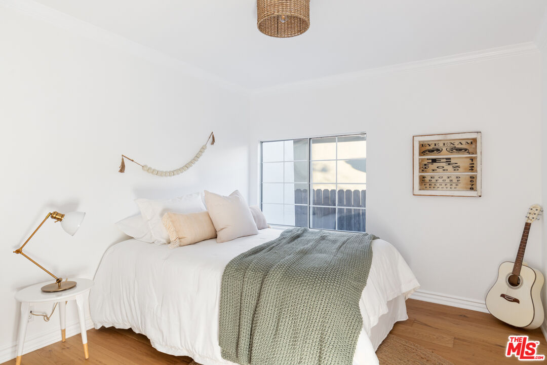 3420 Buckingham Road Los Angeles, CA 90016 - Photo 14 of 41 a bedroom with a bed and a window