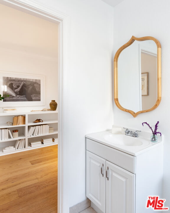 3420 Buckingham Road Los Angeles, CA 90016 - Photo 17 of 41 a bathroom with a sink vanity and a mirror