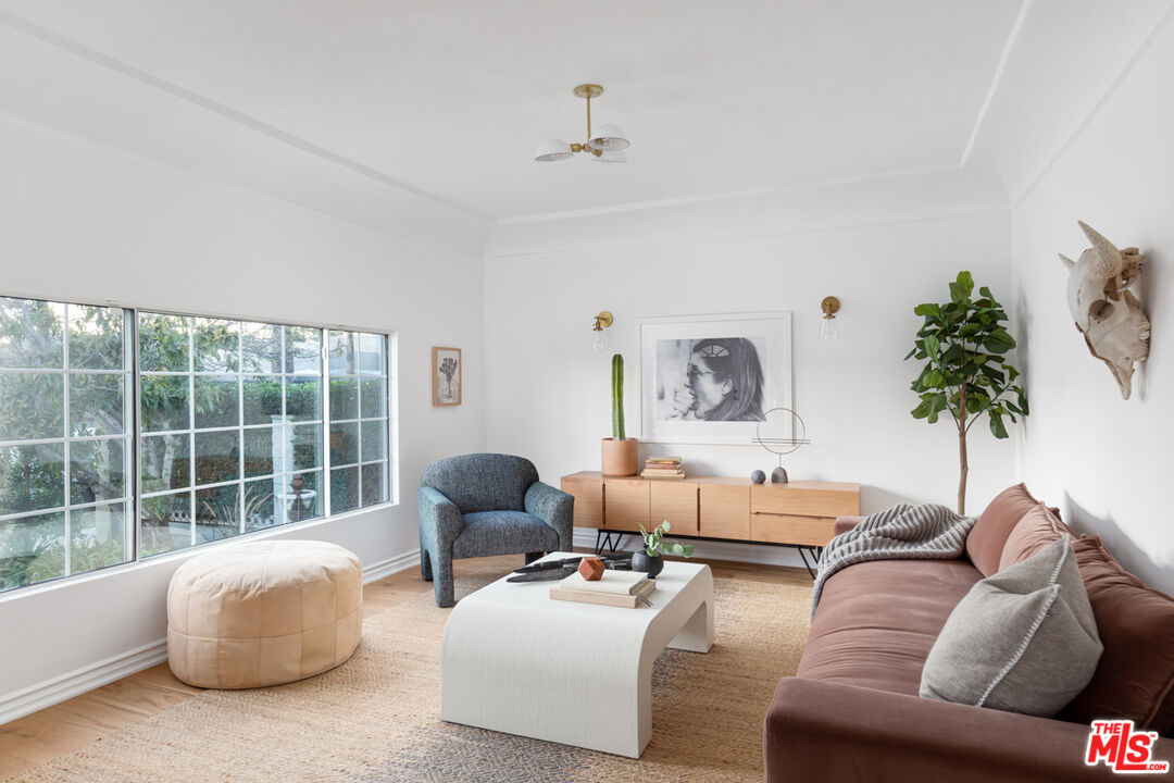 3420 Buckingham Road Los Angeles, CA 90016 - Photo 3 of 41 a living room with furniture and a large window