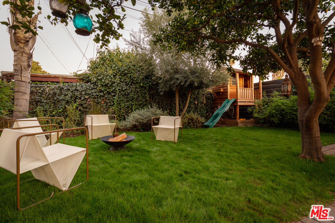 3420 Buckingham Road Los Angeles, CA 90016 - Photo 25 of 41 a view of a chair and table in backyard