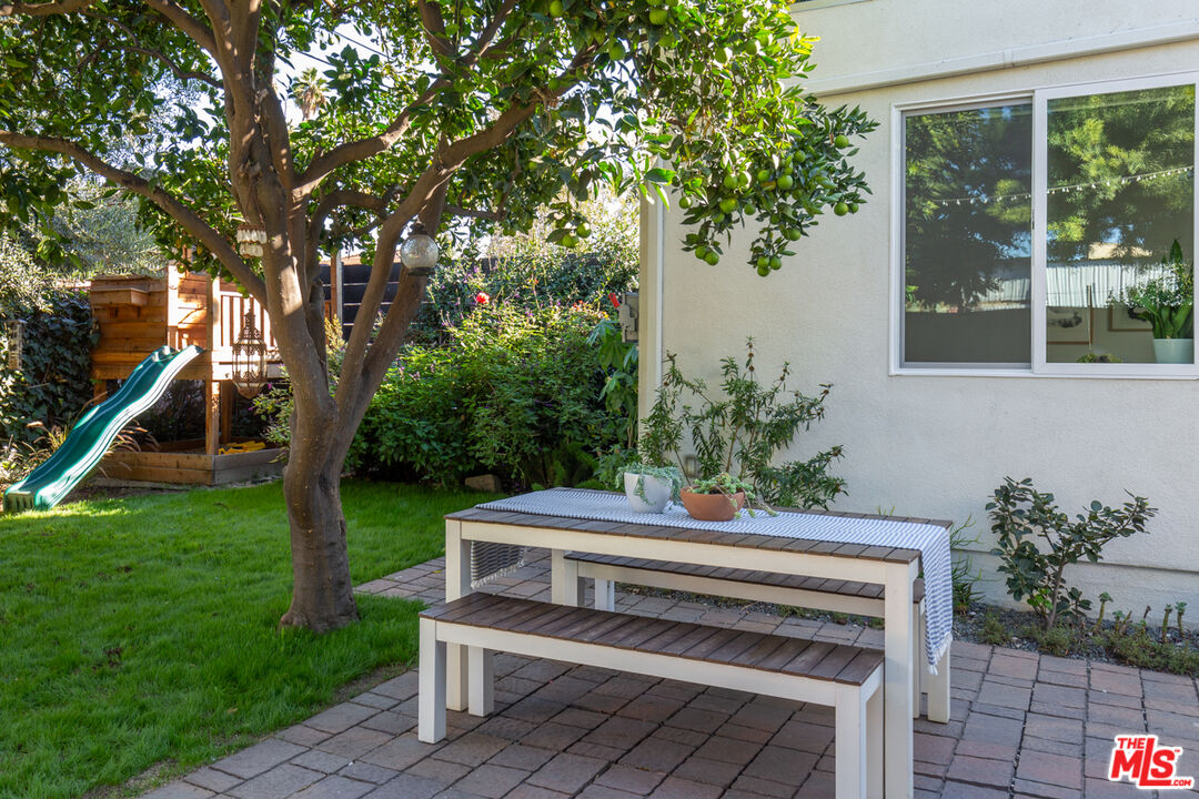 3420 Buckingham Road Los Angeles, CA 90016 - Photo 27 of 41 a view of a chair and table in the garden