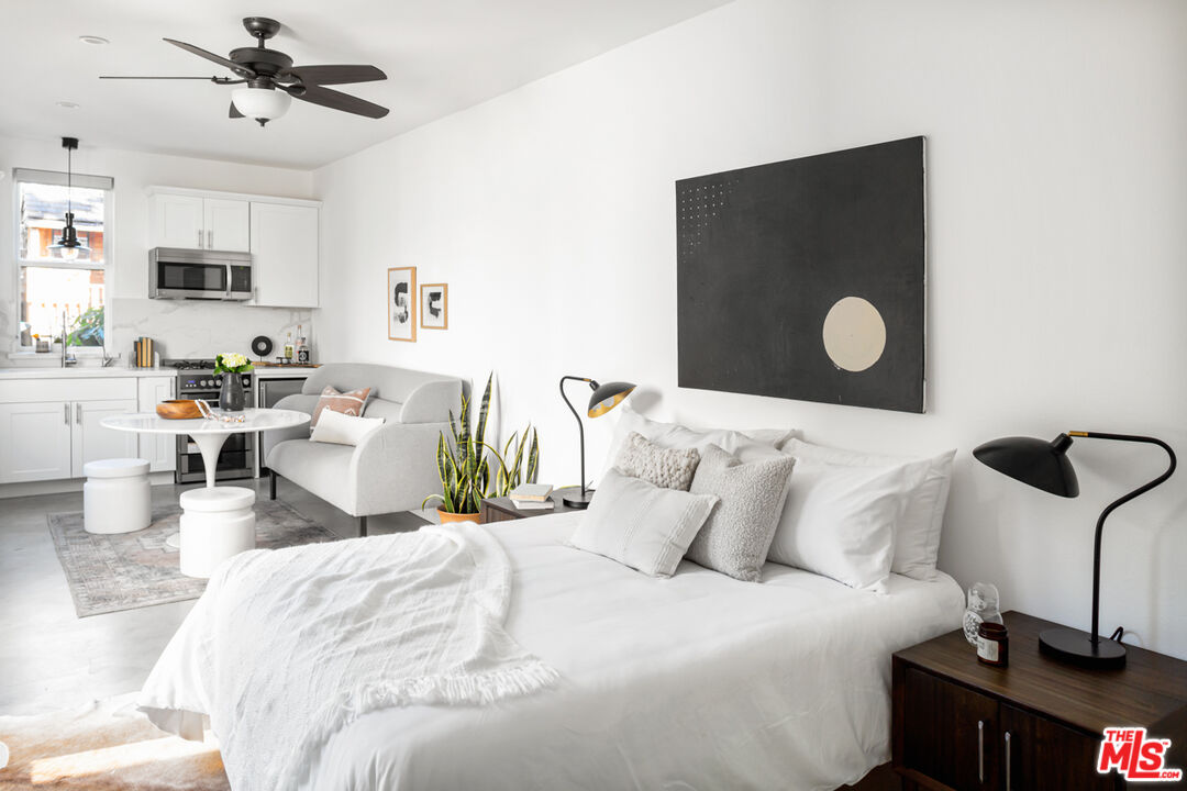3420 Buckingham Road Los Angeles, CA 90016 - Photo 29 of 41 a bedroom with a bed and window