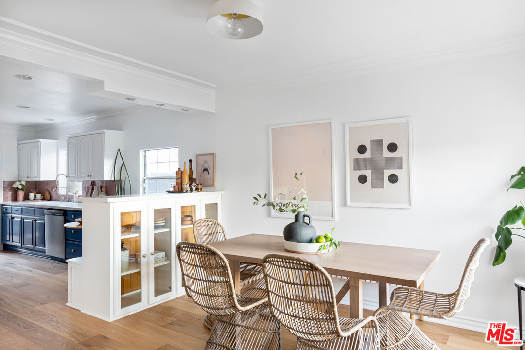 3420 Buckingham Road Los Angeles, CA 90016 - Photo 6 of 41 a dining room with furniture and wooden floor