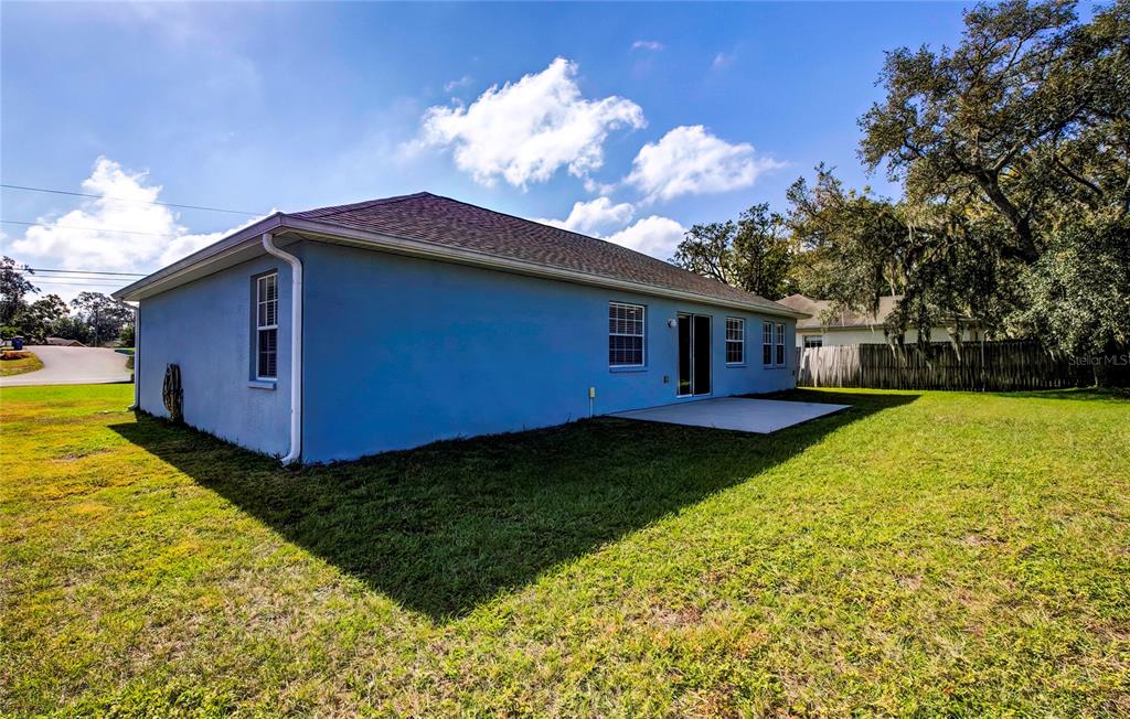 7325 Millstone Street Spring Hill, FL 34606 - Photo 6 of 46 Rear and Side View