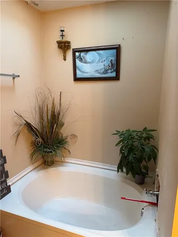 a white bath tub sitting in a bathroom
