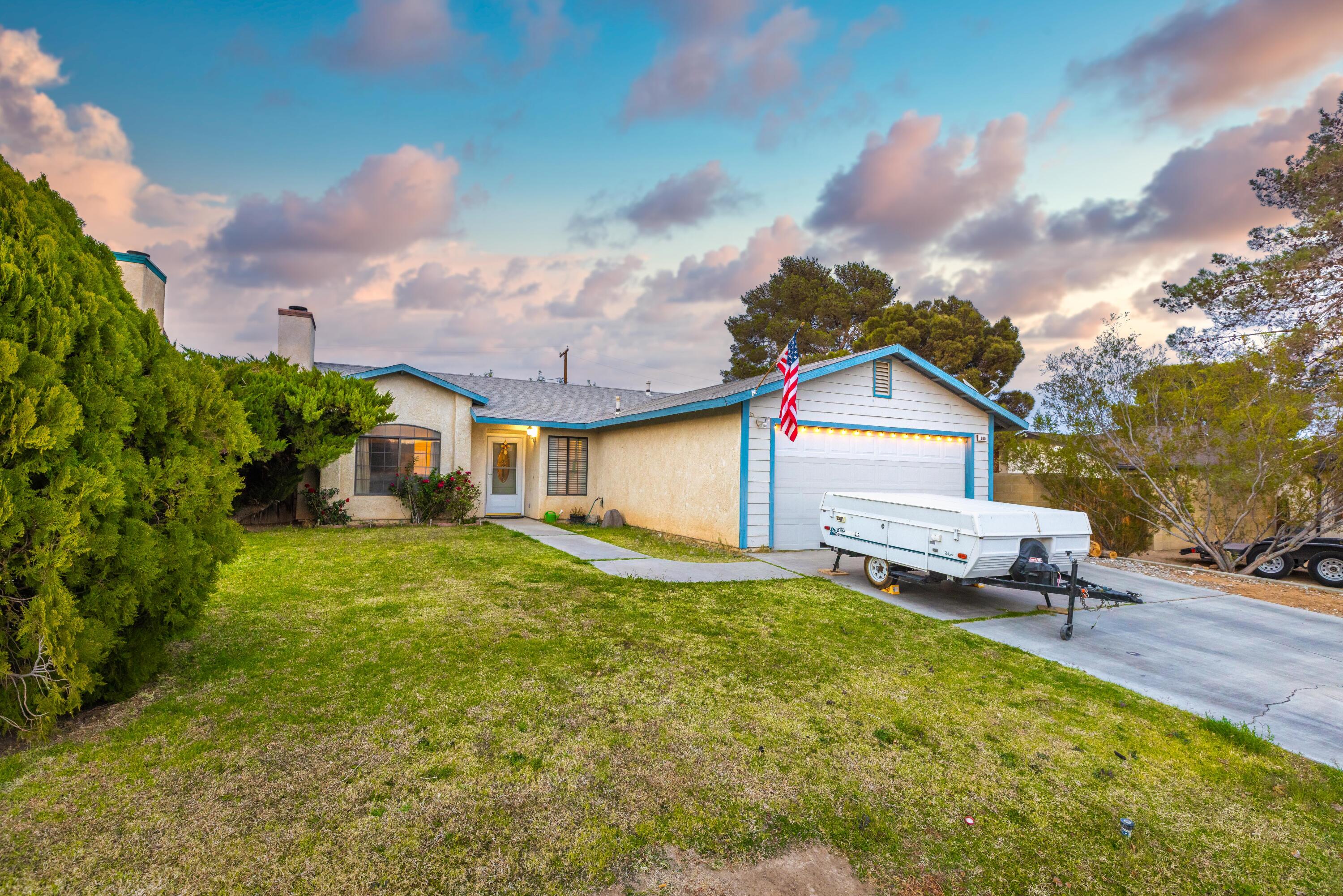 920 West Perch Avenue Ridgecrest, CA 93555 - Photo 2 of 26 a front view of a house with a yard