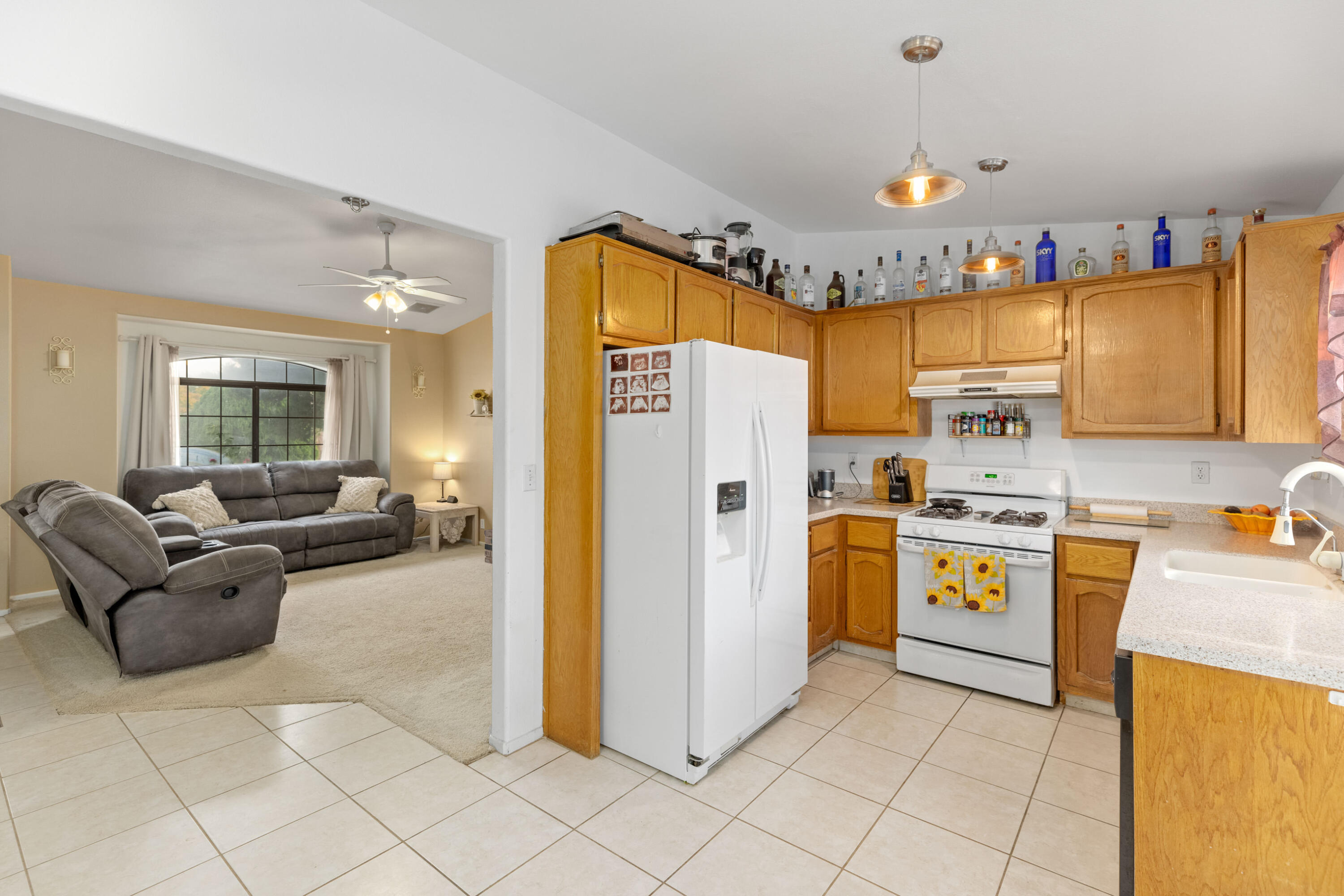 920 West Perch Avenue Ridgecrest, CA 93555 - Photo 11 of 26 a kitchen with stainless steel appliances granite countertop a refrigerator and a stove top oven