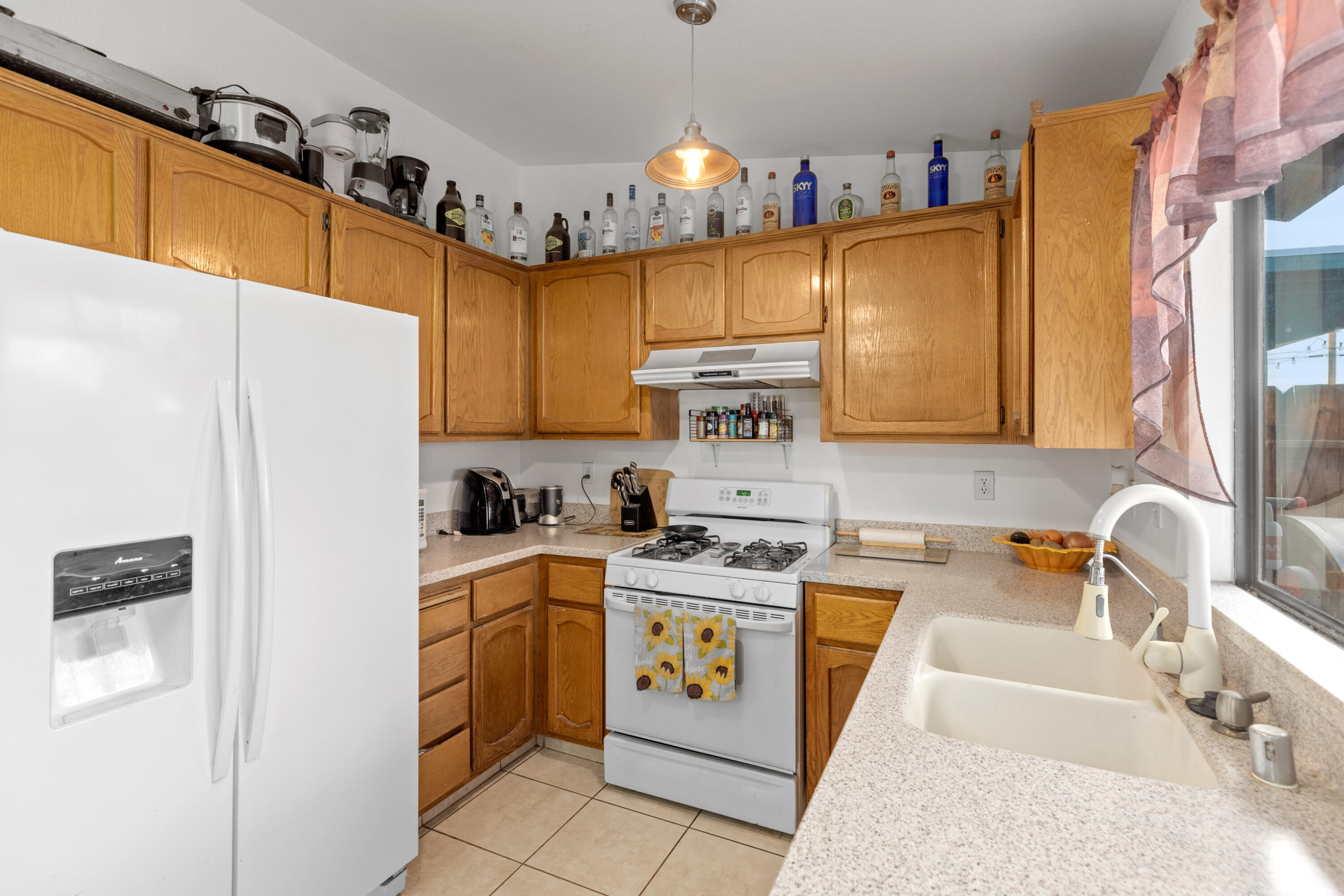 920 West Perch Avenue Ridgecrest, CA 93555 - Photo 12 of 26 a kitchen with stainless steel appliances granite countertop a sink stove and refrigerator