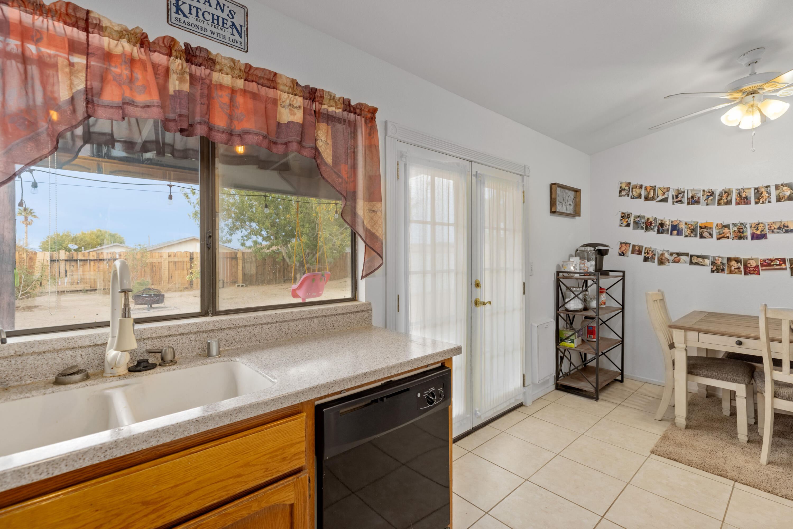 920 West Perch Avenue Ridgecrest, CA 93555 - Photo 13 of 26 a kitchen with a sink and a large window