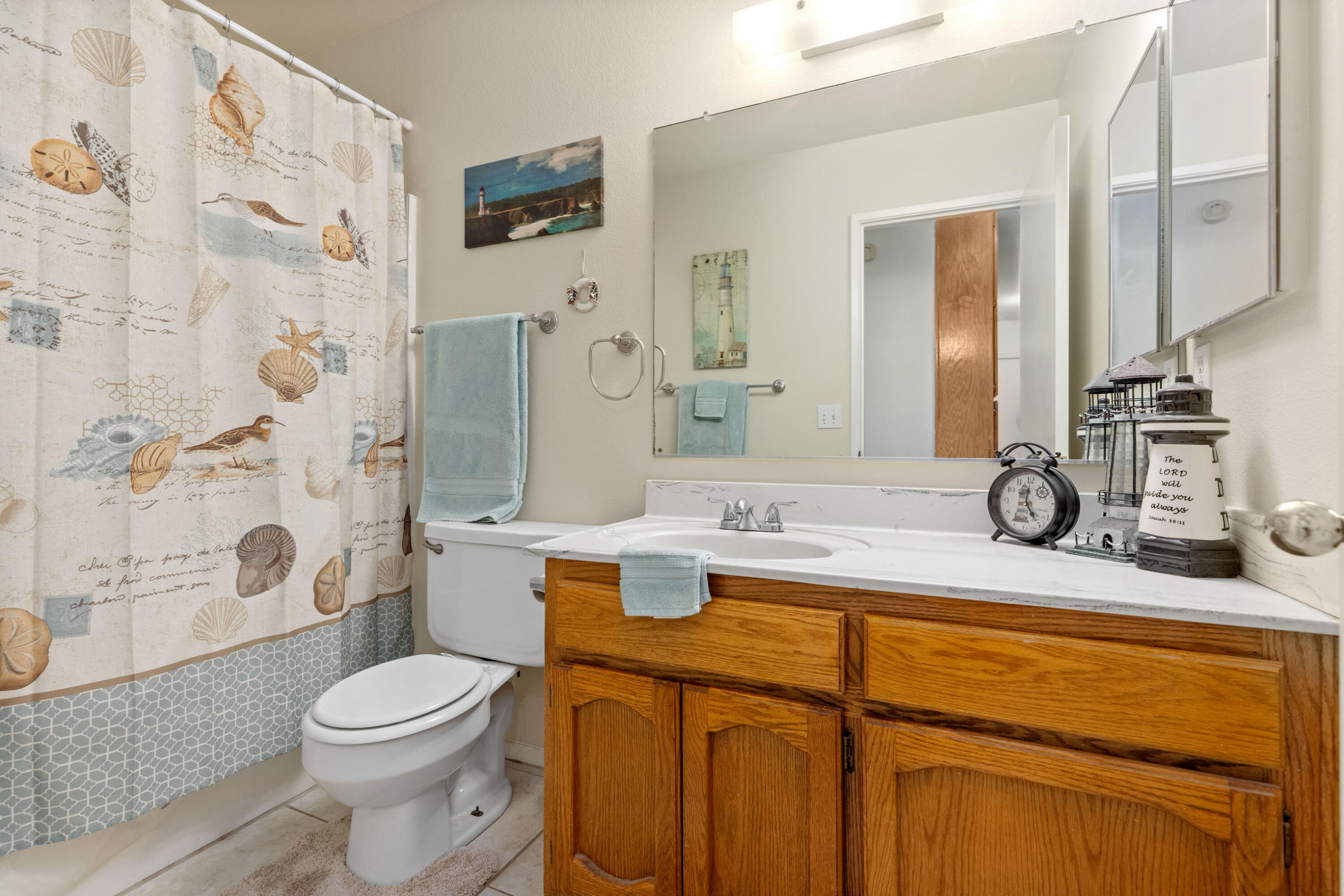 920 West Perch Avenue Ridgecrest, CA 93555 - Photo 15 of 26 a bathroom with a granite countertop sink toilet and shower