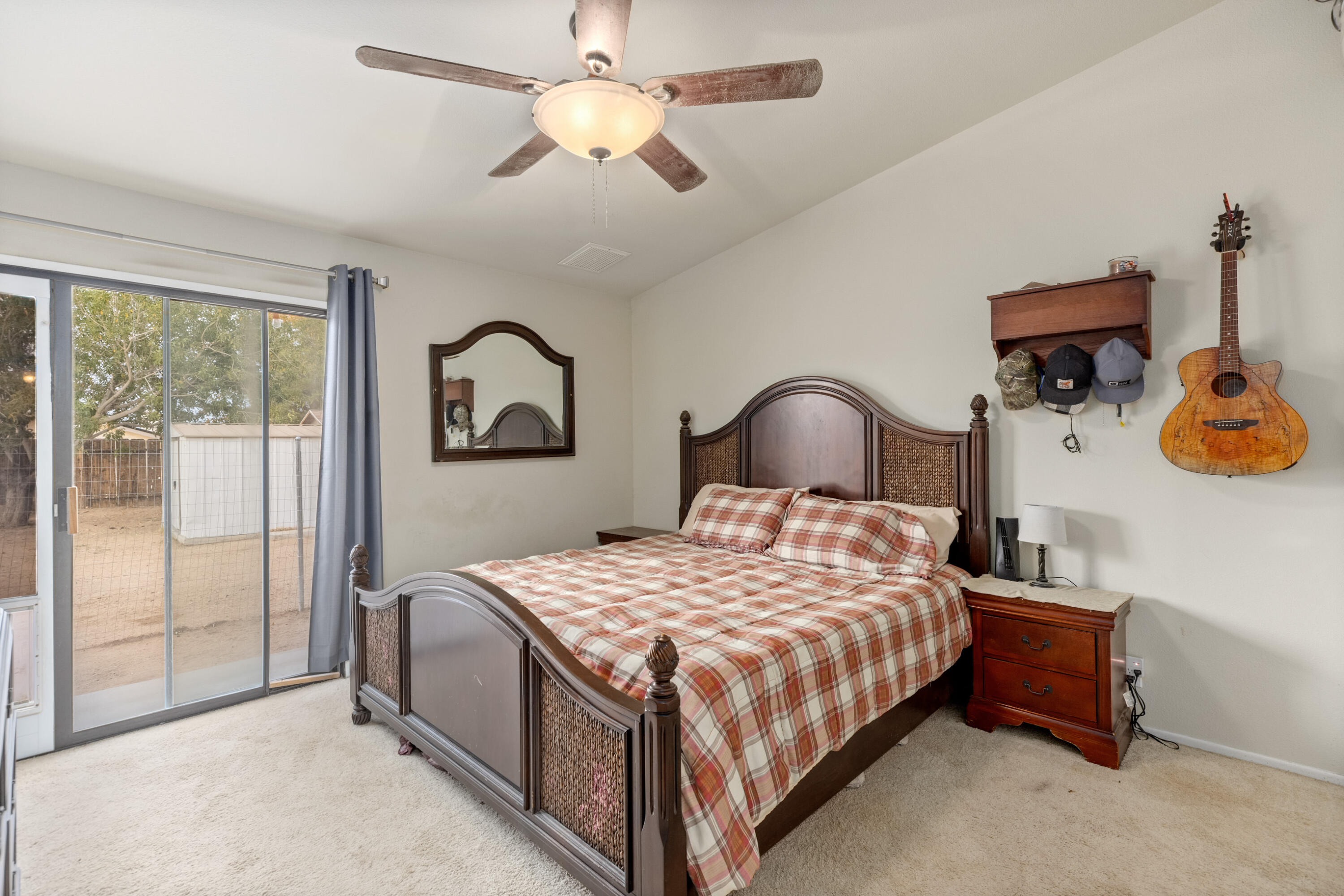 920 West Perch Avenue Ridgecrest, CA 93555 - Photo 16 of 26 a bedroom with a bed and a painting on the wall