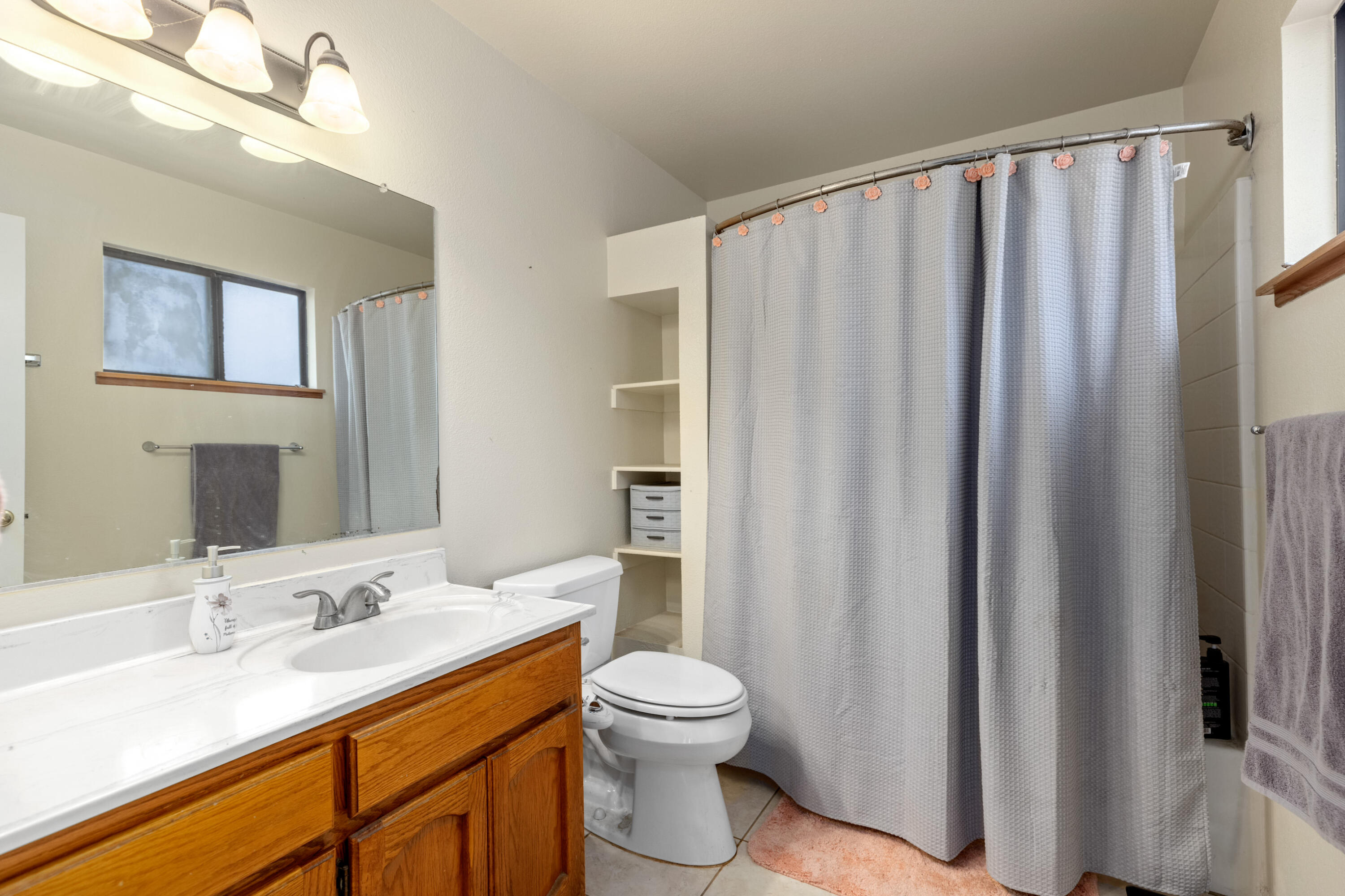 920 West Perch Avenue Ridgecrest, CA 93555 - Photo 18 of 26 a bathroom with a granite countertop sink toilet and shower