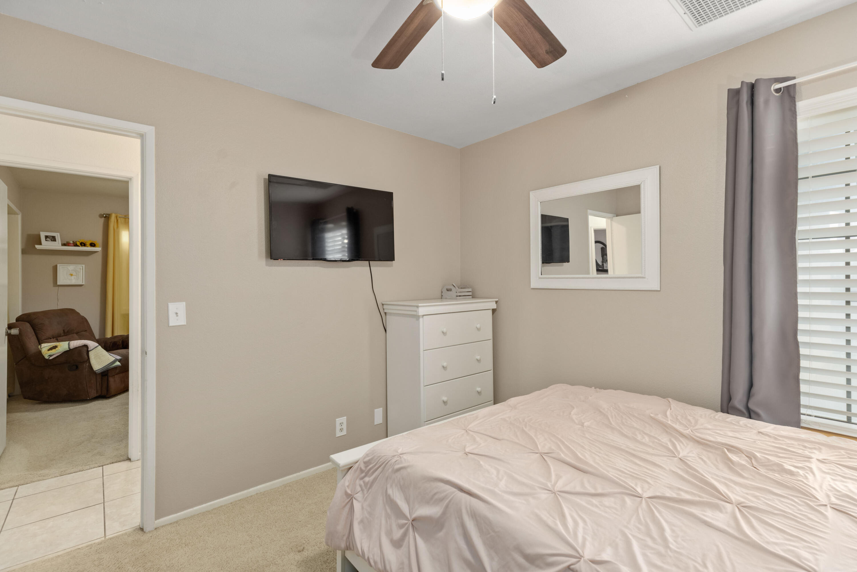 920 West Perch Avenue Ridgecrest, CA 93555 - Photo 20 of 26 a bedroom with a bed and a flat tv screen