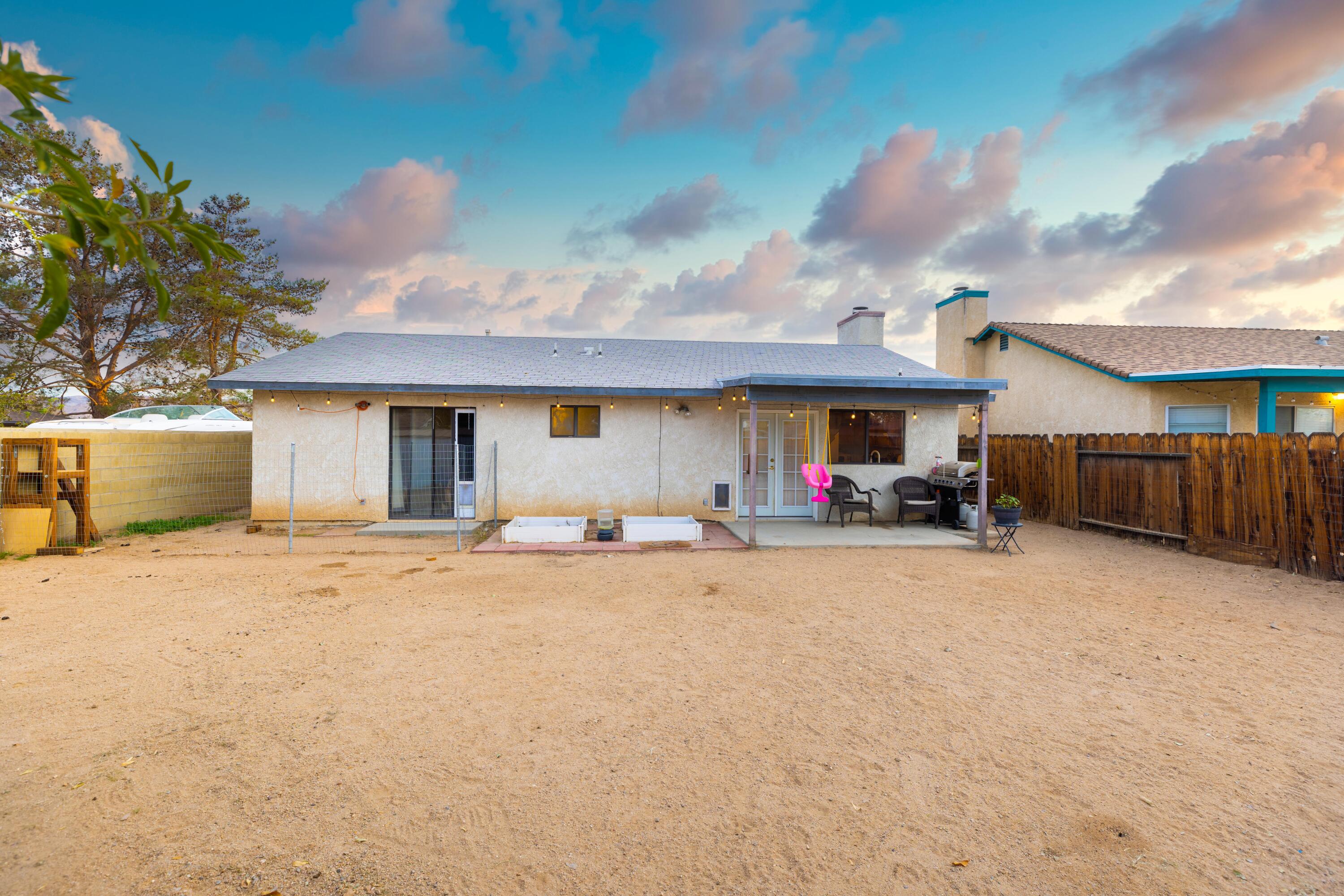 920 West Perch Avenue Ridgecrest, CA 93555 - Photo 26 of 26 a view of a house with backyard and a tree