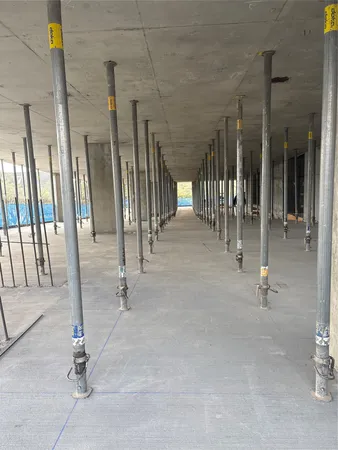 a view of a hall with wooden floor