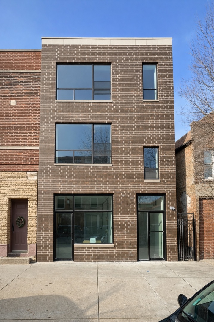3122 South Morgan Street Chicago, IL 60608 - Photo 1 of 33 a building with a door