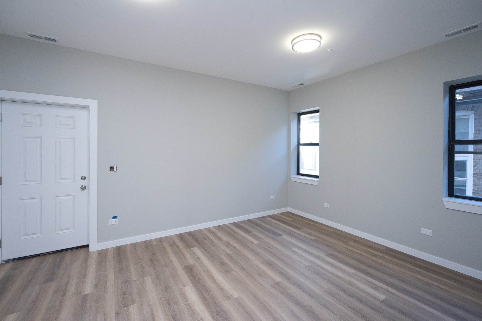 3122 South Morgan Street Chicago, IL 60608 - Photo 11 of 33 a view of room with hardwood floor and window