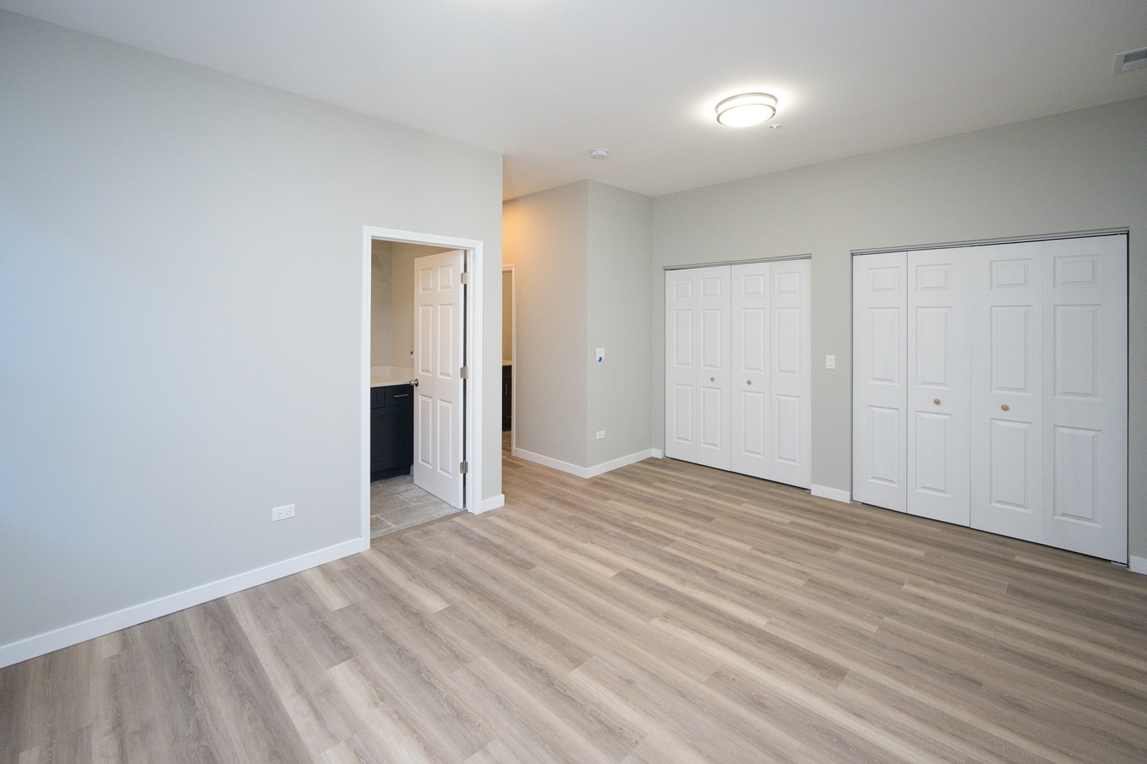 3122 South Morgan Street Chicago, IL 60608 - Photo 12 of 33 a view of an empty room with wooden floor