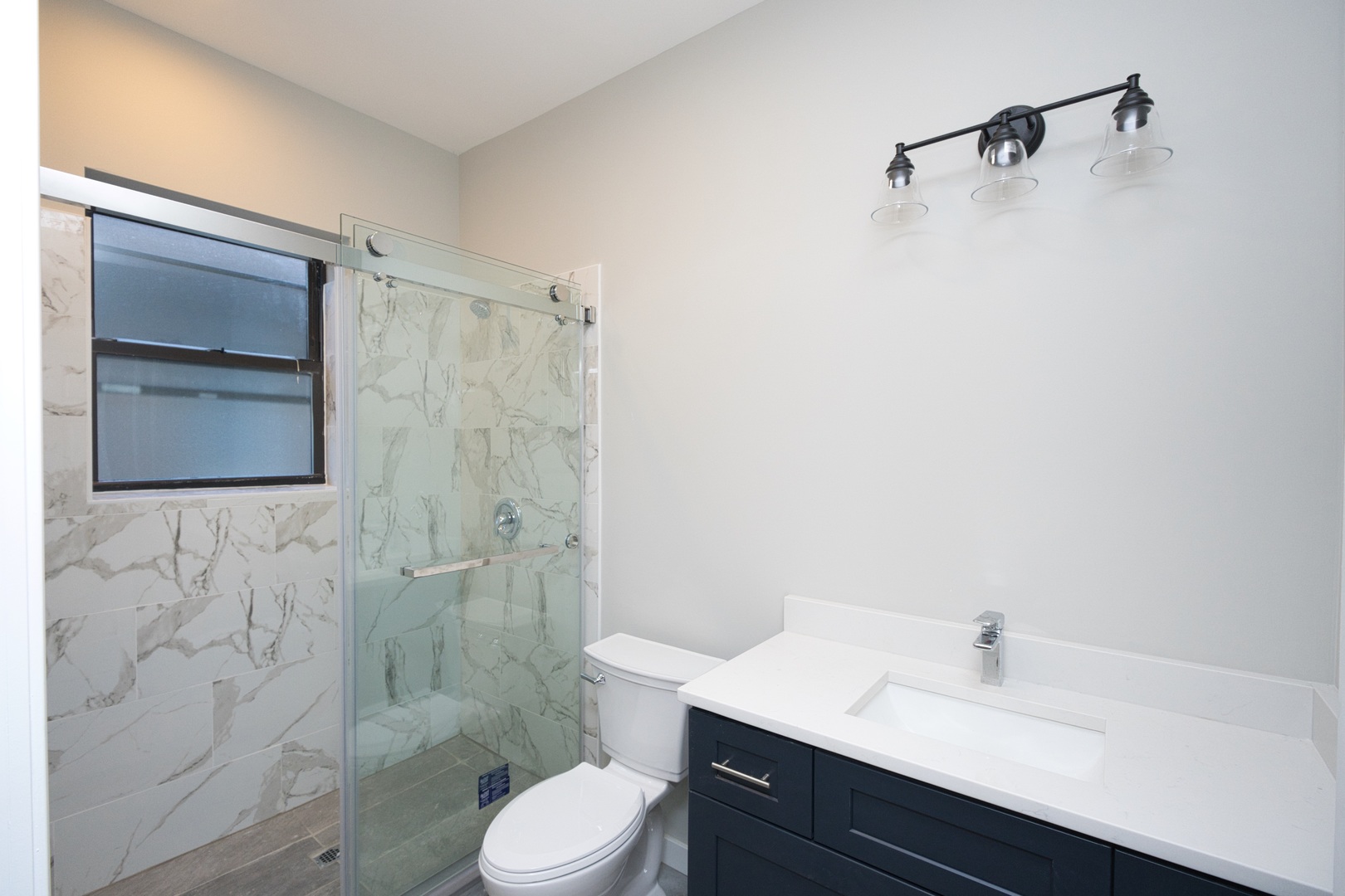 3122 South Morgan Street Chicago, IL 60608 - Photo 13 of 33 a bathroom with a sink toilet and shower