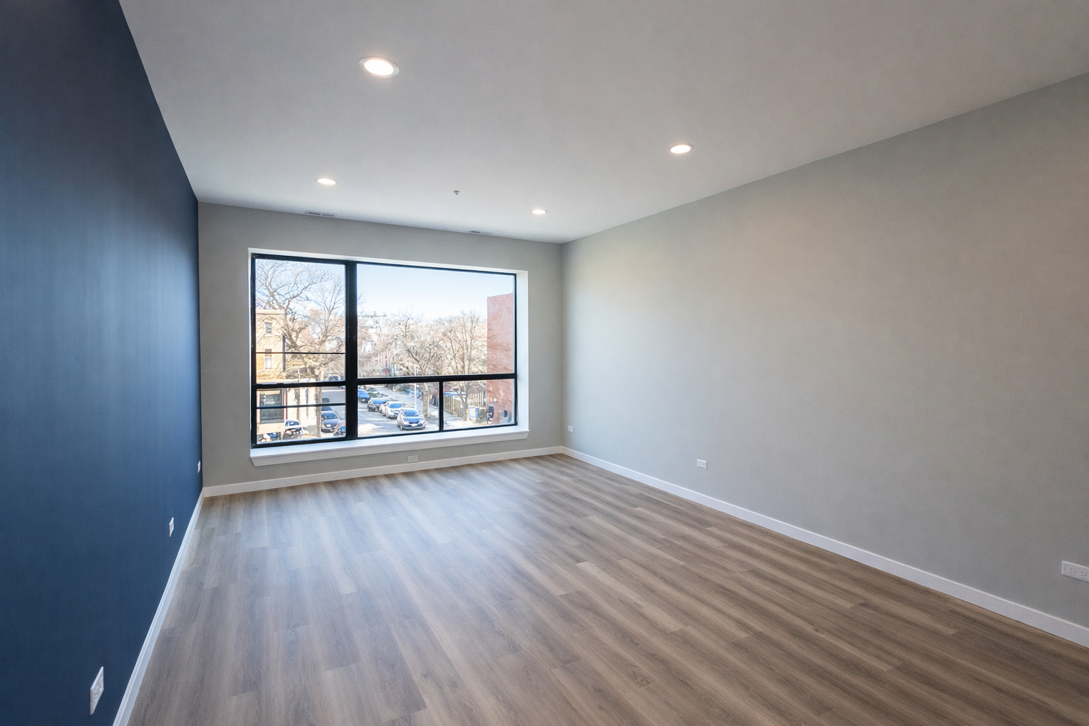 3122 South Morgan Street Chicago, IL 60608 - Photo 16 of 33 a view of an empty room with wooden floor and a window