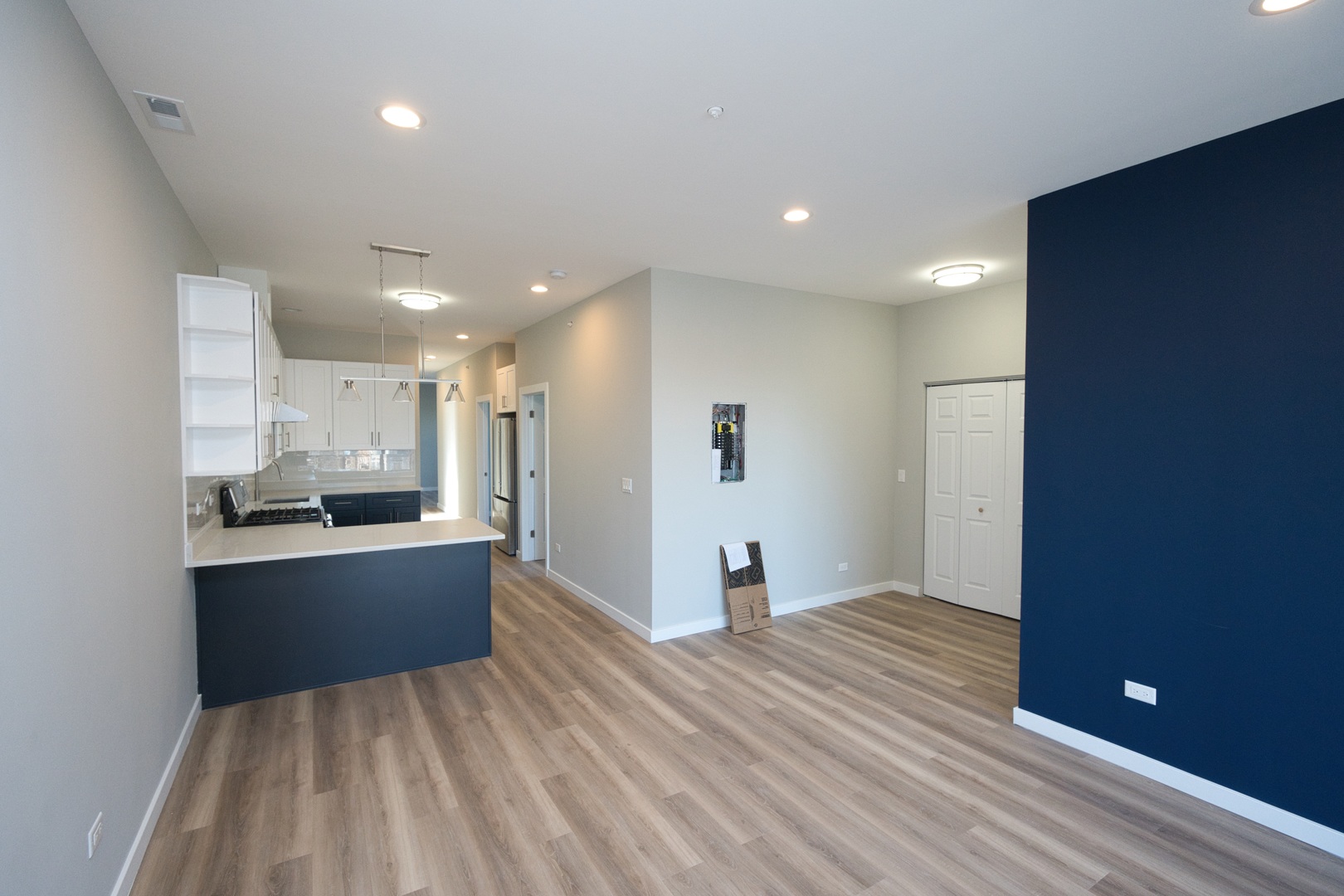 3122 South Morgan Street Chicago, IL 60608 - Photo 18 of 33 a view of kitchen and empty room with wooden floor