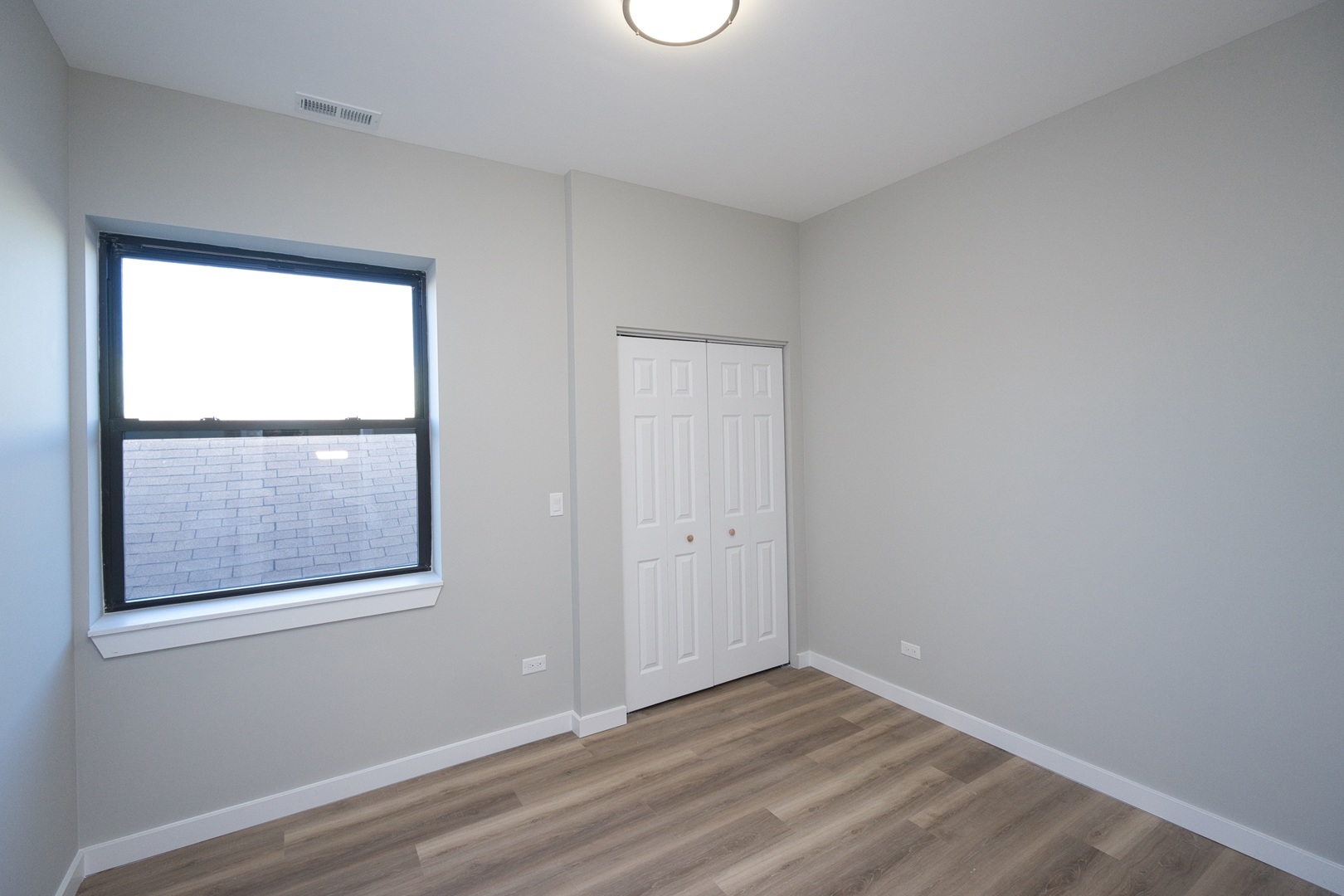 3122 South Morgan Street Chicago, IL 60608 - Photo 20 of 33 an empty room with a window