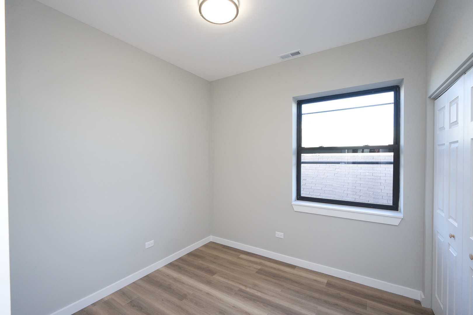 3122 South Morgan Street Chicago, IL 60608 - Photo 21 of 33 a view of an empty room with a window
