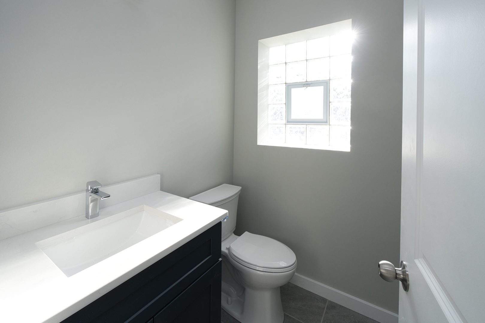 3122 South Morgan Street Chicago, IL 60608 - Photo 22 of 33 a bathroom with a sink a toilet and window