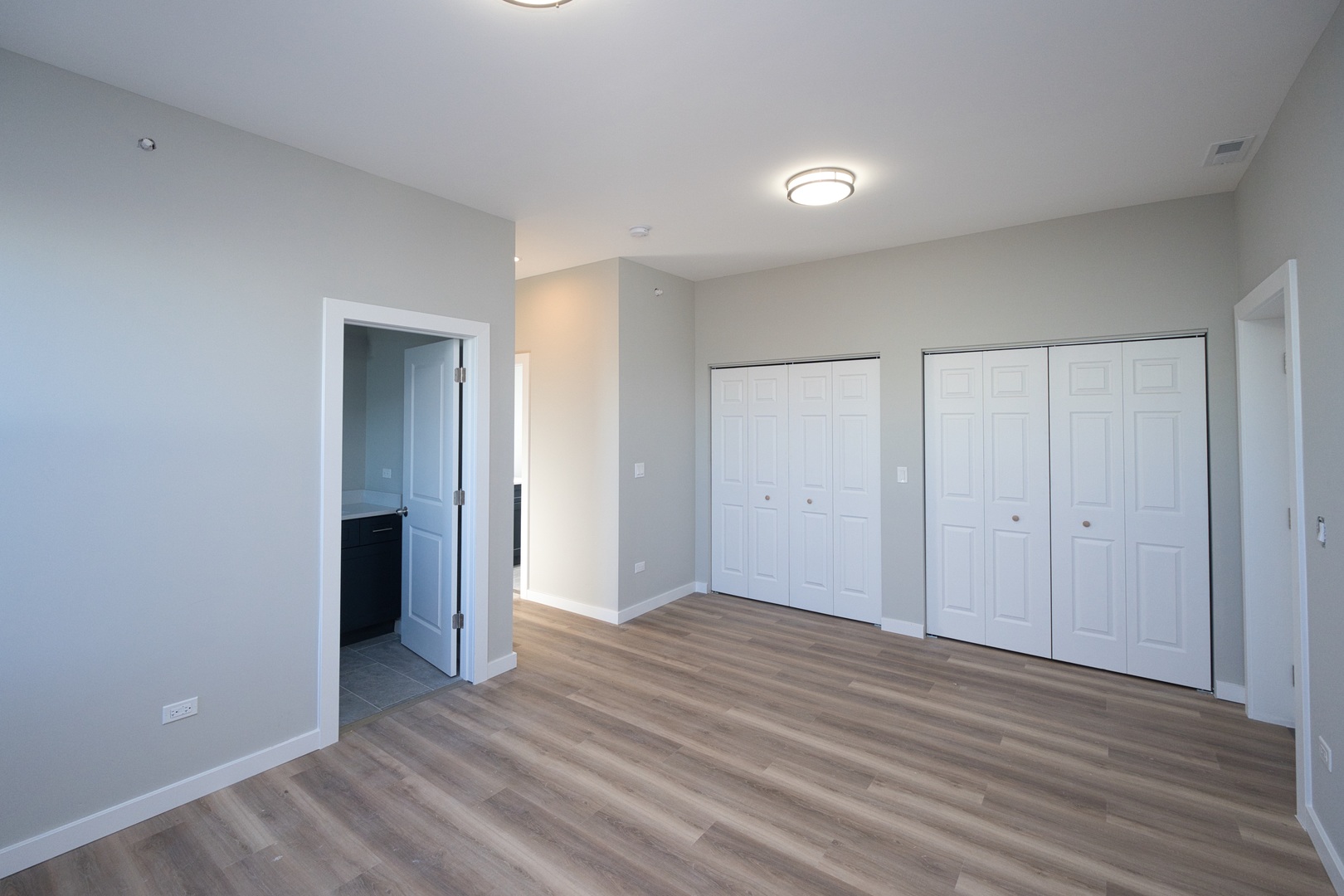 3122 South Morgan Street Chicago, IL 60608 - Photo 26 of 33 a view of an empty room with wooden floor and closet