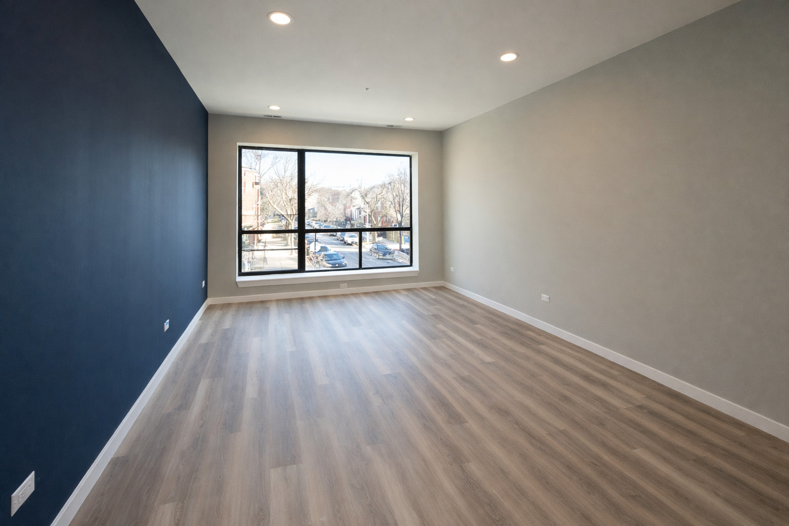 3122 South Morgan Street Chicago, IL 60608 - Photo 3 of 33 wooden floor in an empty room with a window