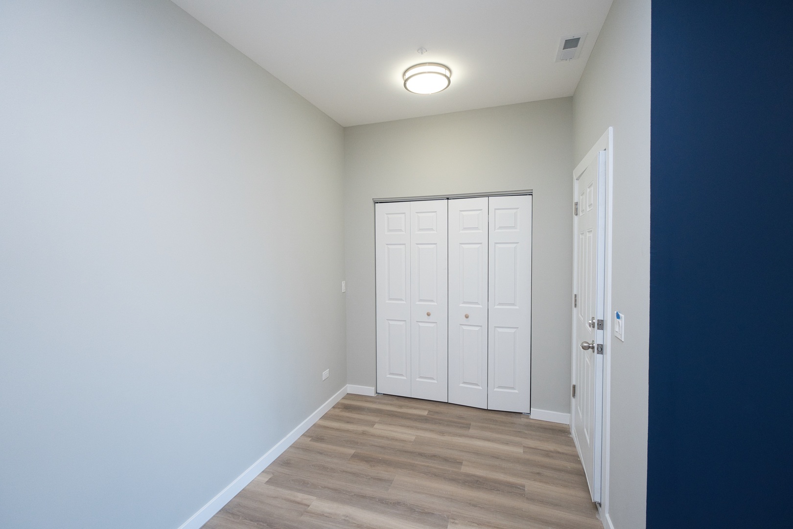 3122 South Morgan Street Chicago, IL 60608 - Photo 4 of 33 a view of an empty room and wooden floor