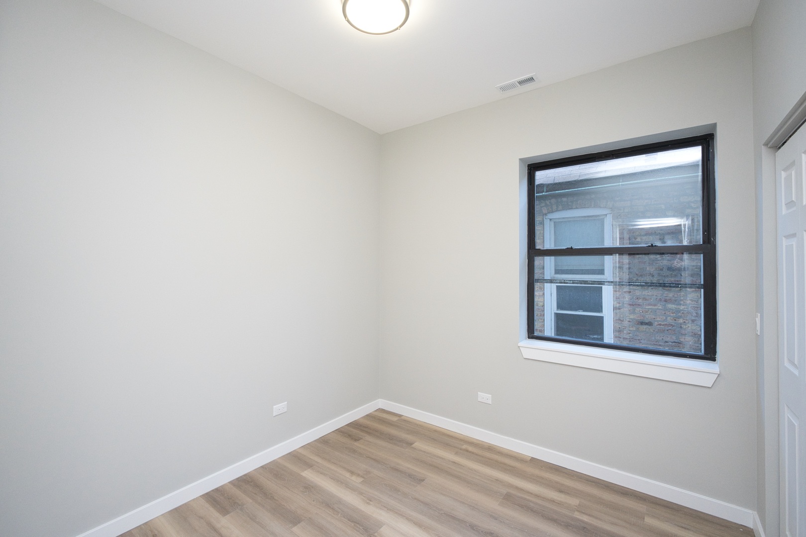 3122 South Morgan Street Chicago, IL 60608 - Photo 8 of 33 a view of empty room with window
