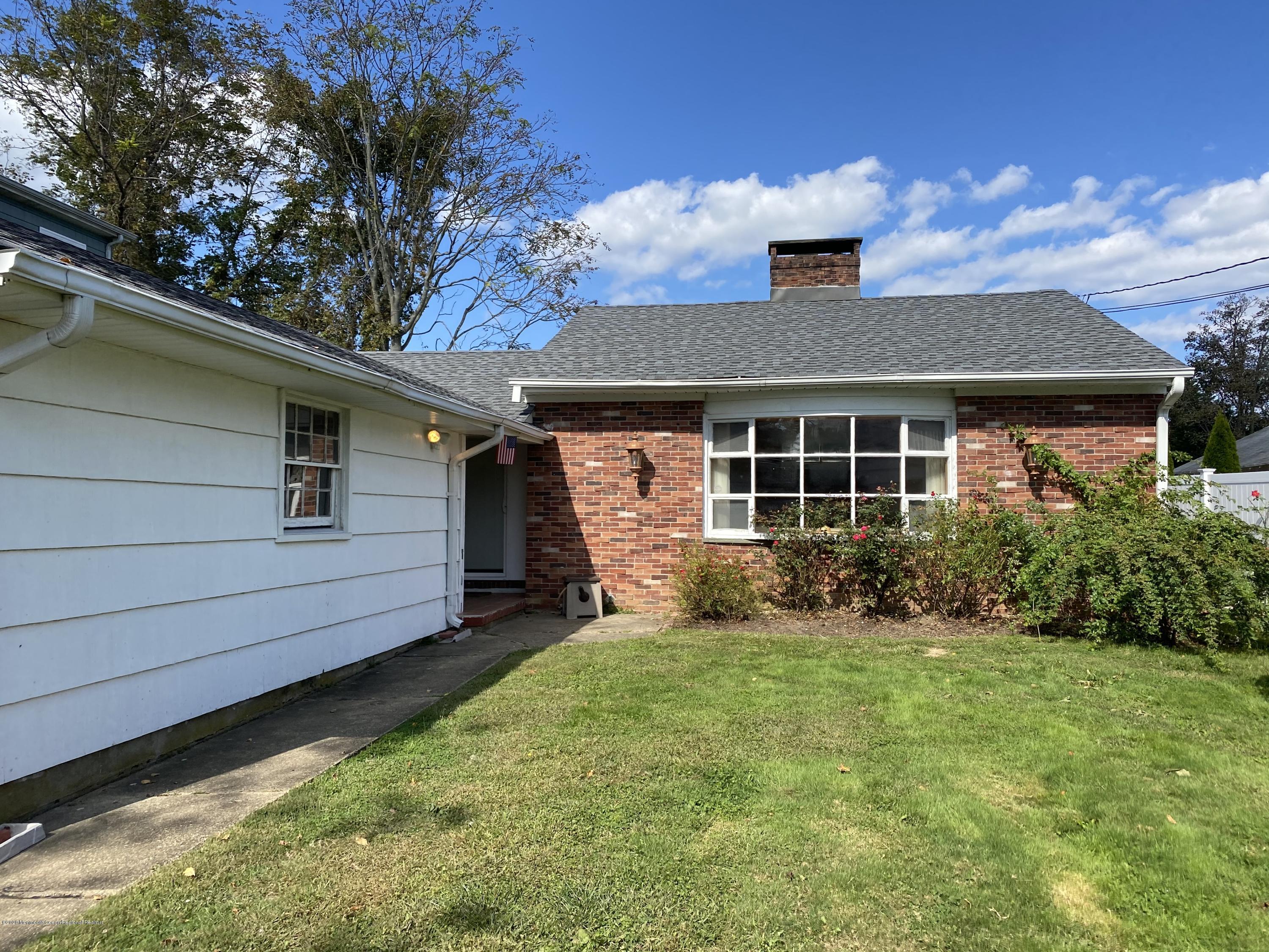 560 Central Avenue, Unit ANNUAL Spring Lake Heights, NJ 07762 - Photo 1 of 14 a front view of a house with garden