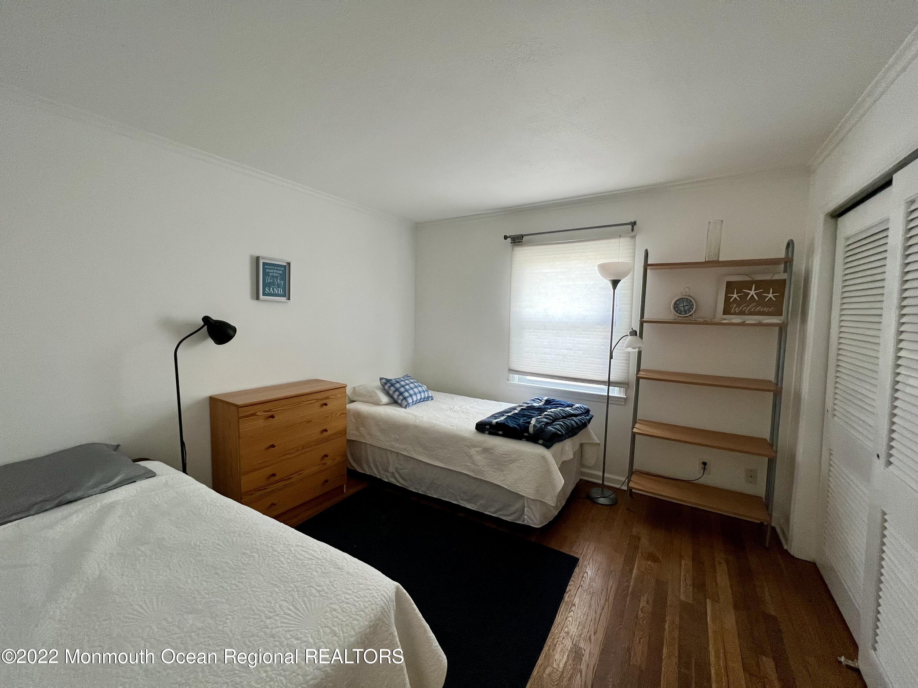 560 Central Avenue, Unit ANNUAL Spring Lake Heights, NJ 07762 - Photo 11 of 14 a bedroom with bed and a dresser