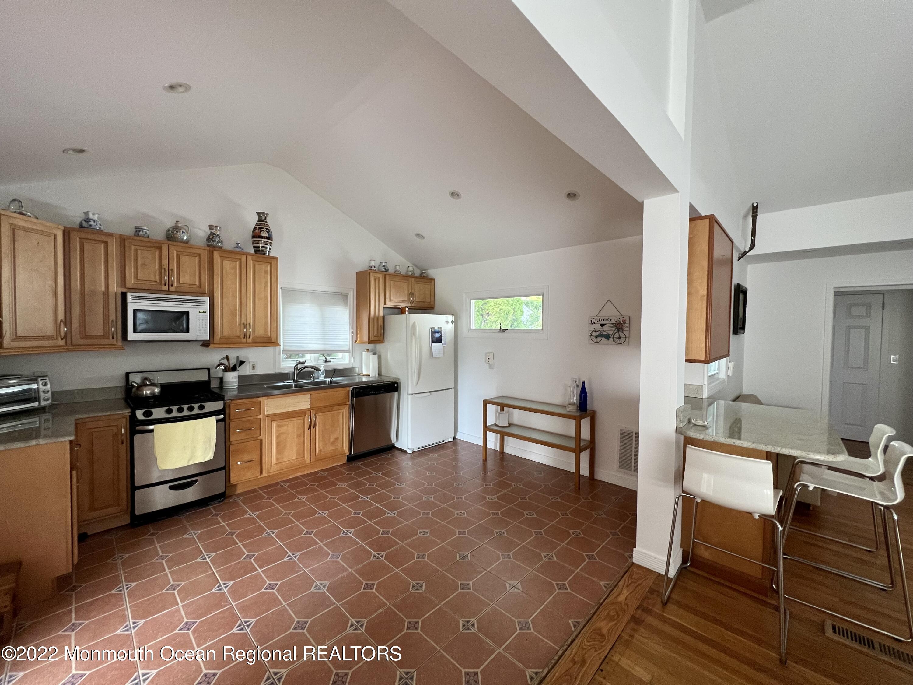 560 Central Avenue, Unit ANNUAL Spring Lake Heights, NJ 07762 - Photo 3 of 14 a large kitchen with granite countertop lots of counter top space and stainless steel appliances