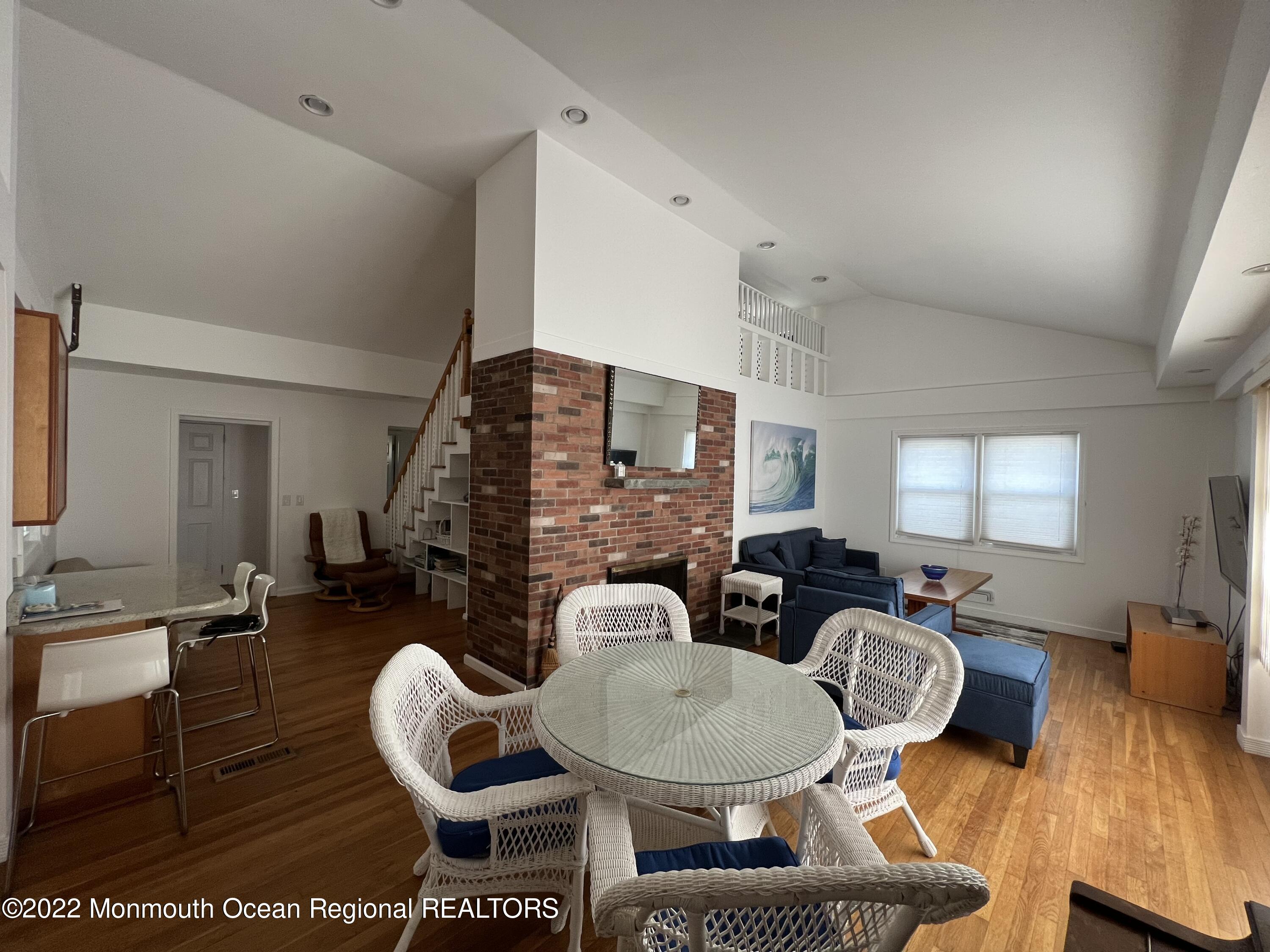 560 Central Avenue, Unit ANNUAL Spring Lake Heights, NJ 07762 - Photo 4 of 14 a living room with furniture a table and wooden floor