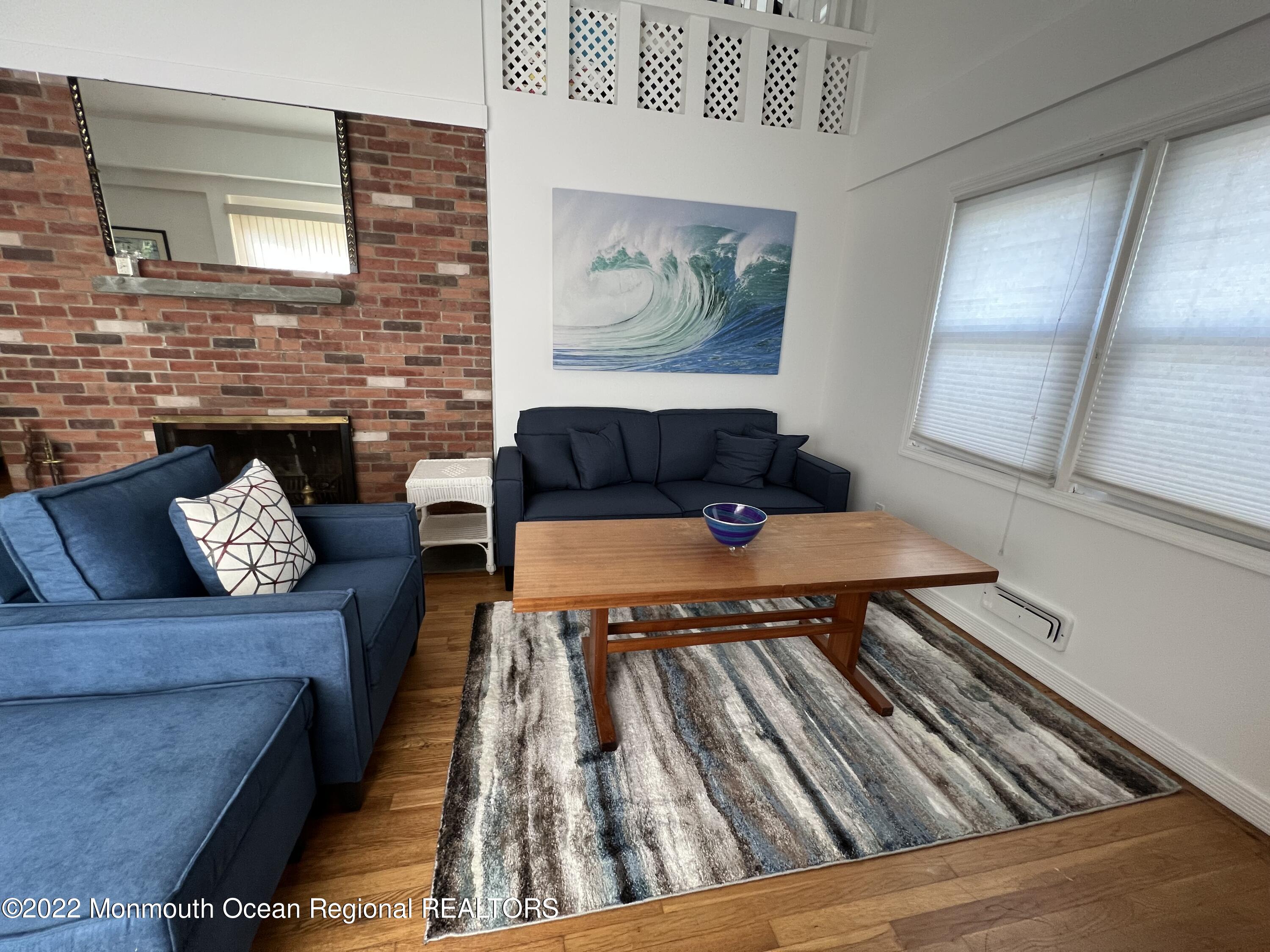 560 Central Avenue, Unit ANNUAL Spring Lake Heights, NJ 07762 - Photo 6 of 14 a living room with furniture and a rug